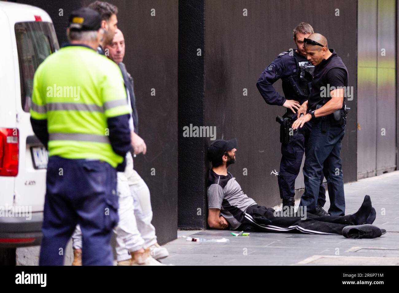 MELBOURNE, AUSTRALIA - MAY 28: A man is arrested for allegedly dealing drugs in the CBD on 28 May, 2020 in Melbourne, Australia. With international flights in and out of Australia almost entirely halted and stricter security measures due to COVID-19, experts are predicting a major decrease in the amount of illicit drugs entering Australia illegally. The side effect being that this may force many to turn to alternative drugs more available locally. Stock Photo
