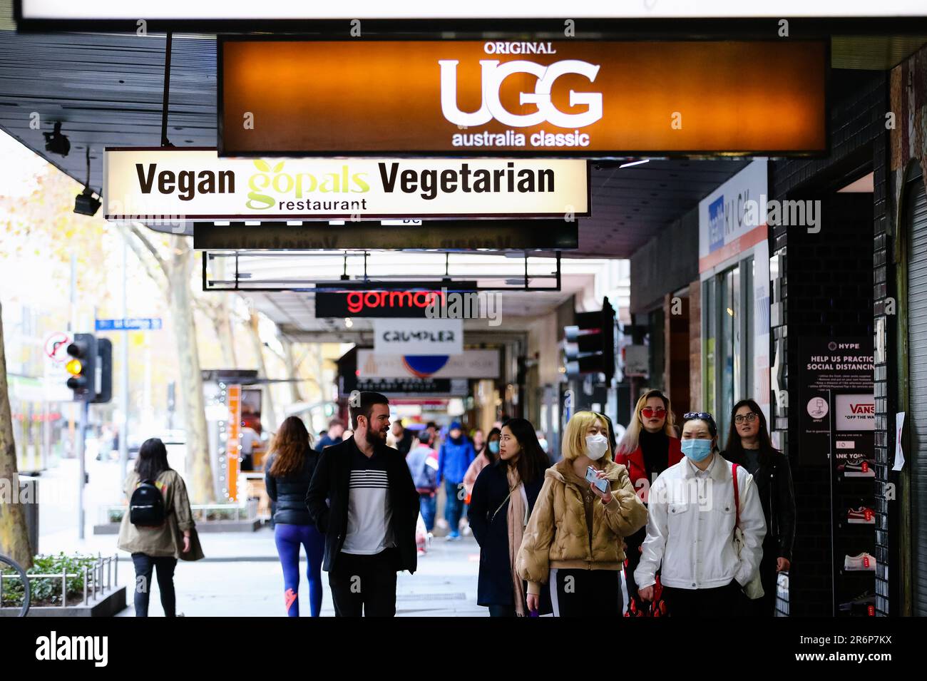 MELBOURNE, AUSTRALIA - June 21: Despite fears of a second wave hitting Victoria, the city is overflowing with shoppers as large groups of people are seen walking past retailers on Swanston Street as restrictions are being tightened in Victoria during COVID 19 on 21 June, 2020 in Melbourne, Australia. After a concerning spike in new coronavirus infections in metropolitan Melbourne which is once again sparking fears of a second wave, the Premier Daniel Andrews announced yesterday (20 June) that restrictions on the number of visitors in private homes will be reduced to ten to five. Victoria recor Stock Photo
