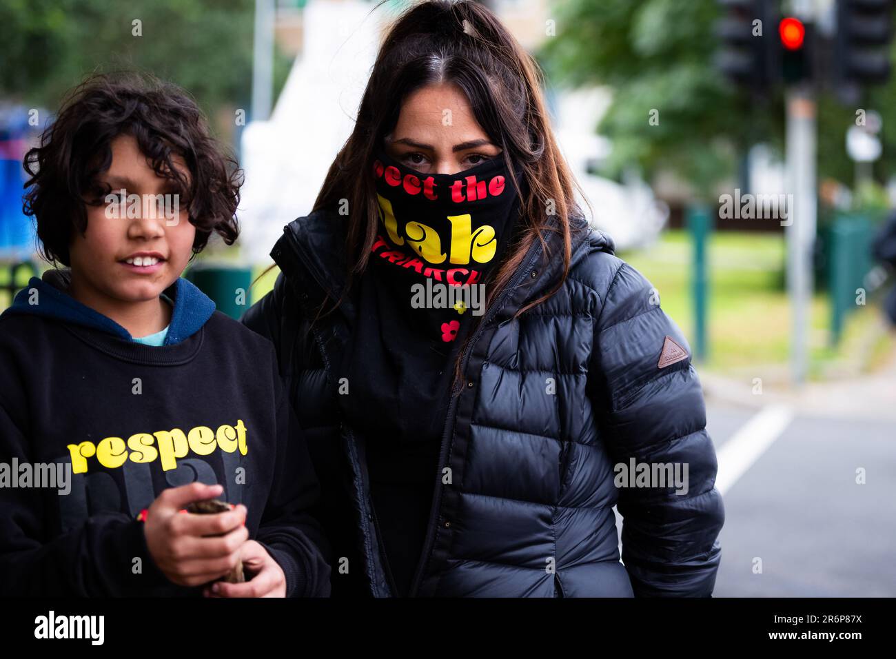 MELBOURNE, AUSTRALIA - JULY 5: Protesters associated with Warriors of the Aboriginal Resistance stand in solidarity with the locked down residents of 120 Racecourse Road  amid a full and total lockdown of 9 housing commission high rise towers in North Melbourne and Flemington during COVID 19 on 5 July, 2020 in Melbourne, Australia. After 108 new cases where uncovered overnight, the Premier Daniel Andrews announced on July 4 that effective at midnight last night, two more suburbs have been added to the suburb by suburb lockdown being Flemington and North Melbourne. Further to that, nine high ri Stock Photo