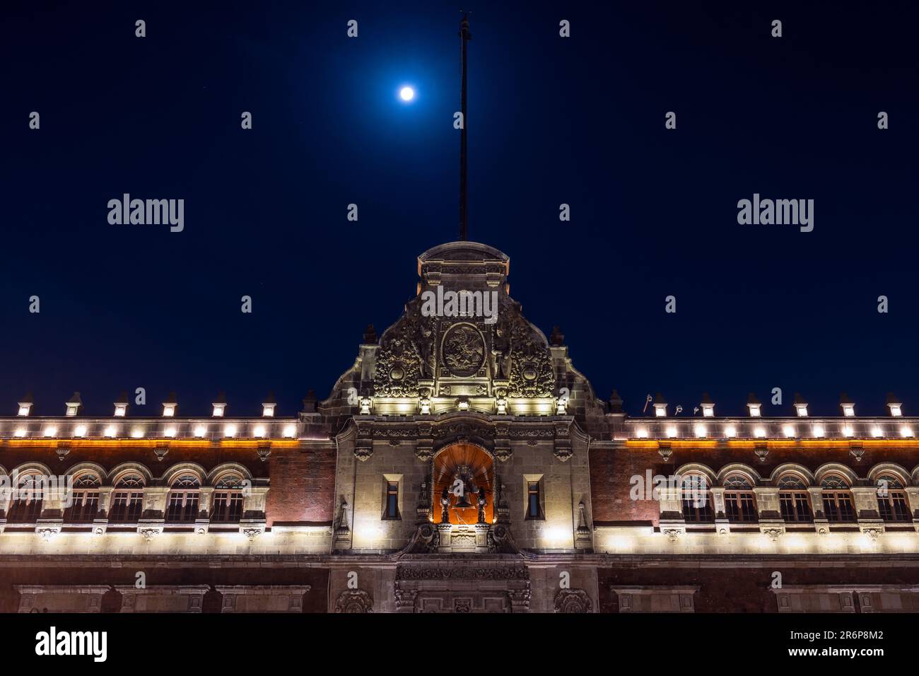 Presidential Palace facade at night with full moon, Mexico City, Mexico. Stock Photo