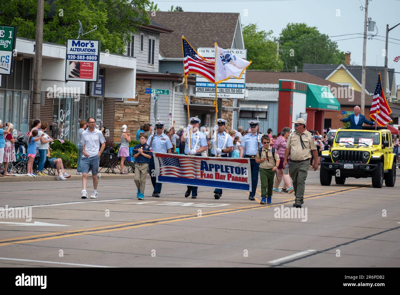 Spectators and participants of the flag day parade in Appleton
