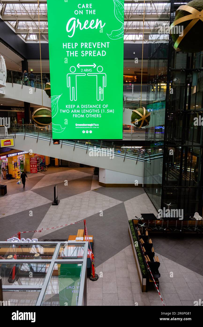 MELBOURNE, AUSTRALIA - APRIL 29: A large sign reminds shoppers to social distance whilst shopping in the Greensborough Plaza during COVID 19 on 29 April, 2020 in Melbourne, Australia. Stock Photo
