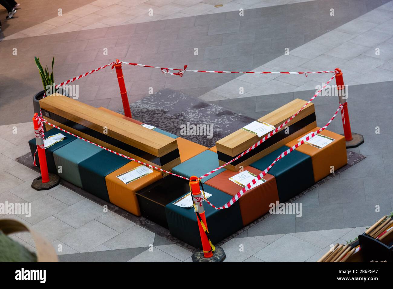 MELBOURNE, AUSTRALIA - APRIL 29: Public seatging is taped off in The Greensborough Plaza during COVID 19 on 29 April, 2020 in Melbourne, Australia. Stock Photo