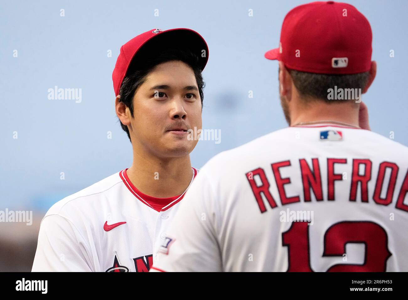 Seattle Mariners' Shohei Ohtani, left, and Mike Trout sit on the bench in  the dugout during a baseball game against the Seattle Mariners, Friday, May  31, 2019, in Seattle. The Mariners won