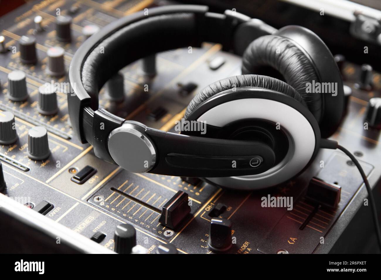 Headphones, mixer and sound engineering equipment in a recording studio for music production closeup. DJ, control and creative with audio technology Stock Photo