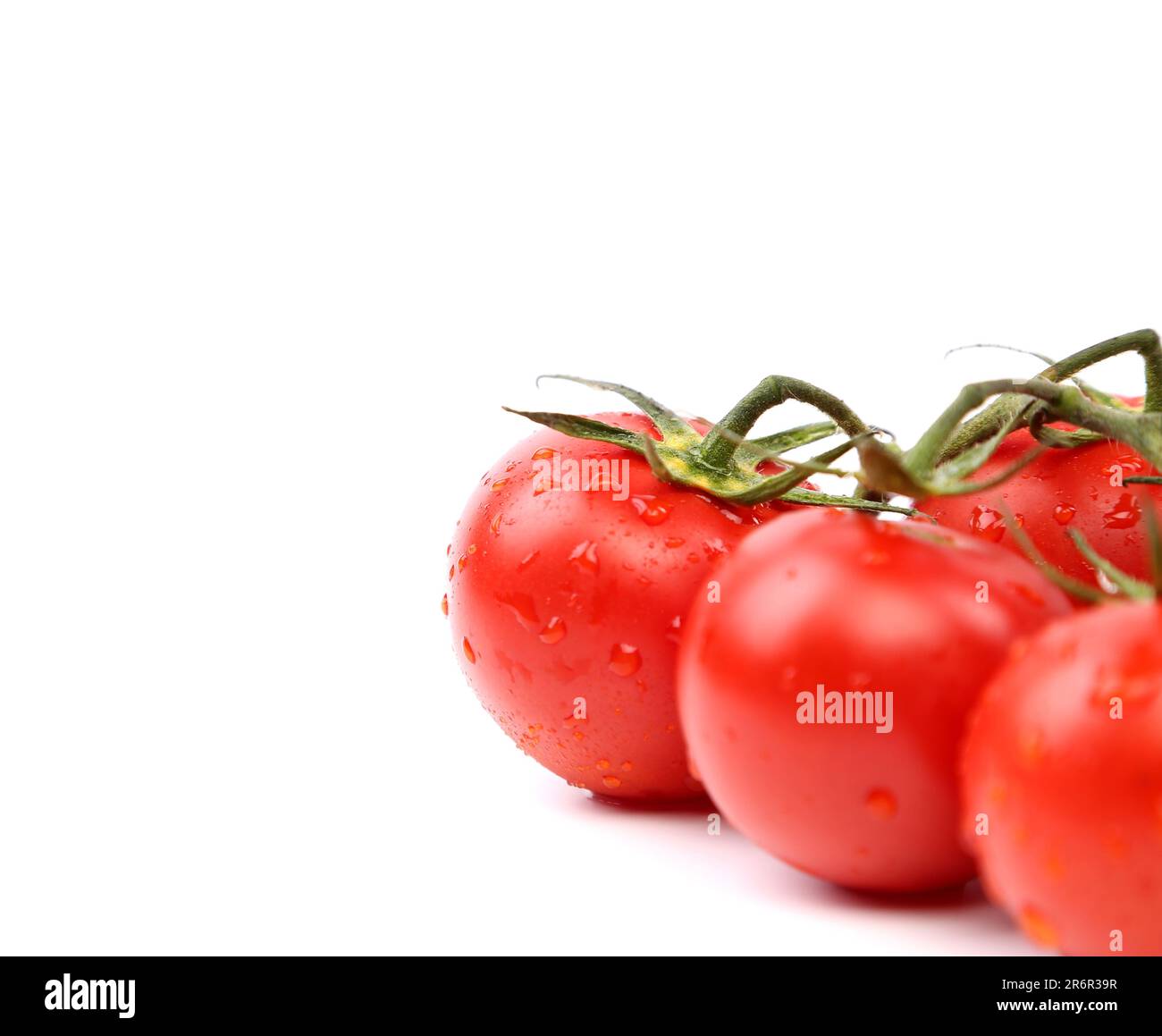 bright red tomatoes isolated on a white background Stock Photo - Alamy