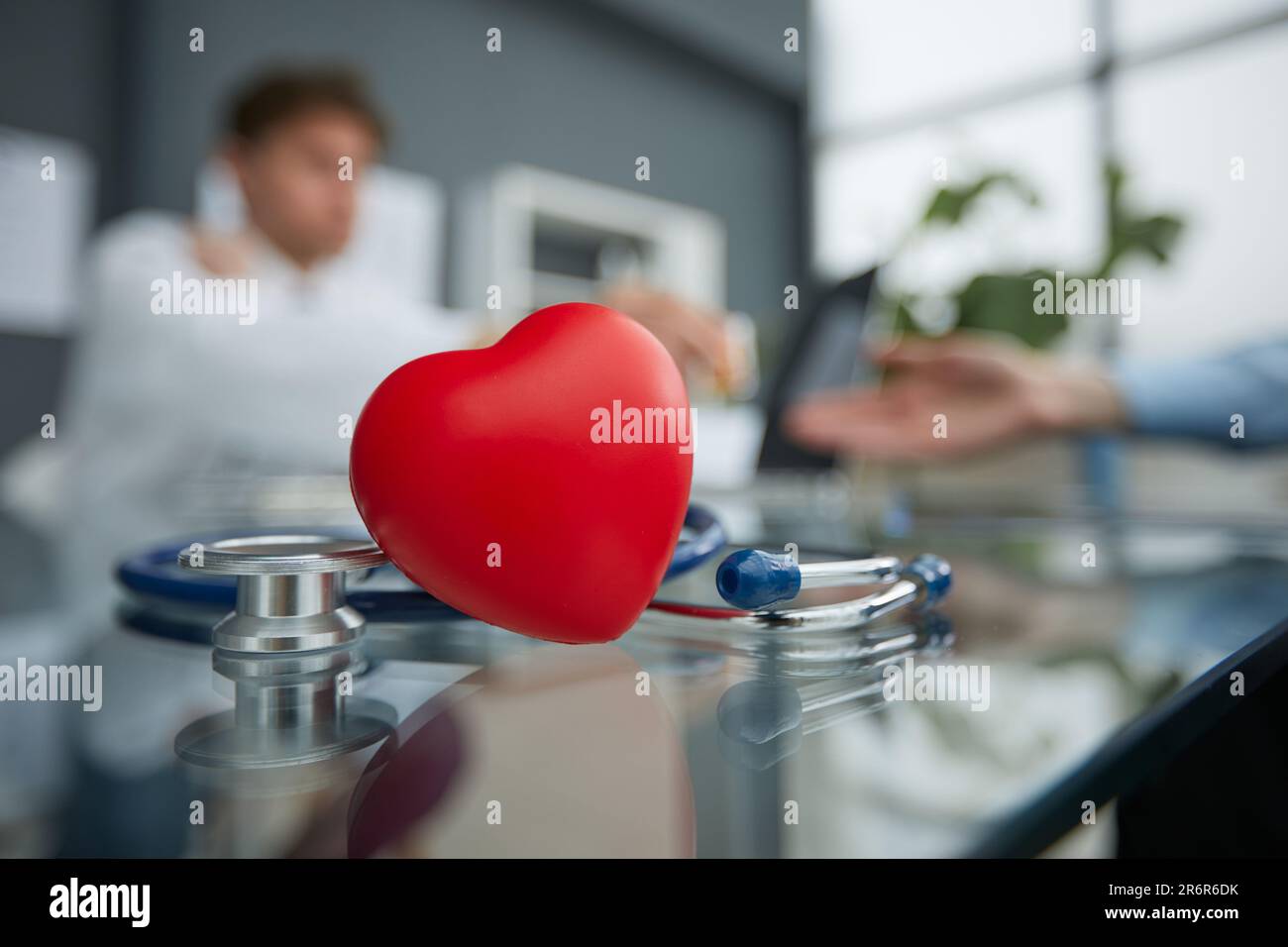 Stethoscope and red heart on wooden table. Cardiology concept Stock ...
