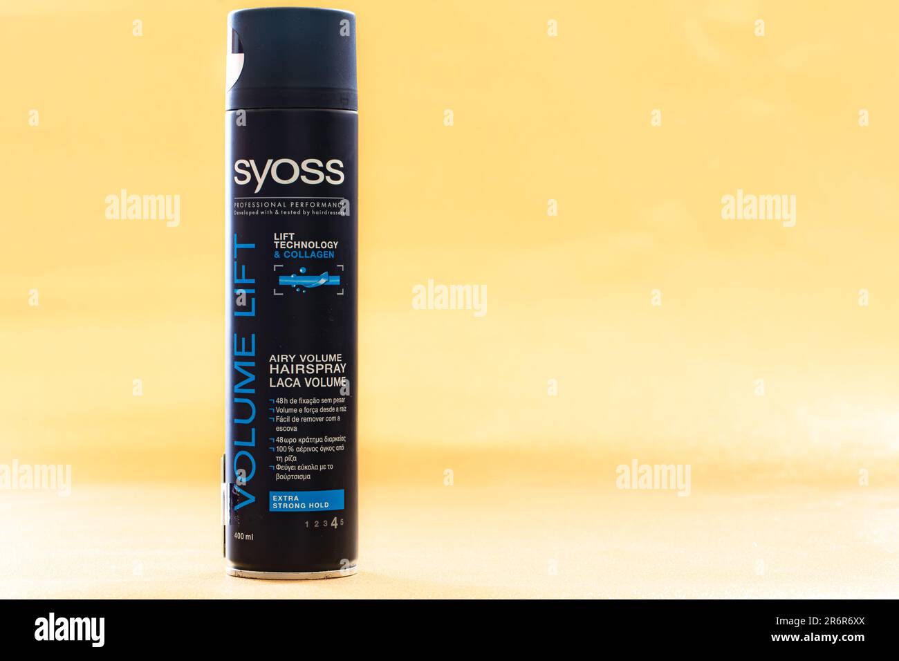 Düsseldorf, Germany - May 30, 2023: Syoss Airy Volume Hairspray isolated on yellow background Stock Photo