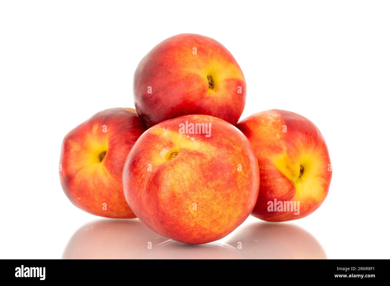 Several sweet nectarines, macro, isolated on white background. Stock Photo