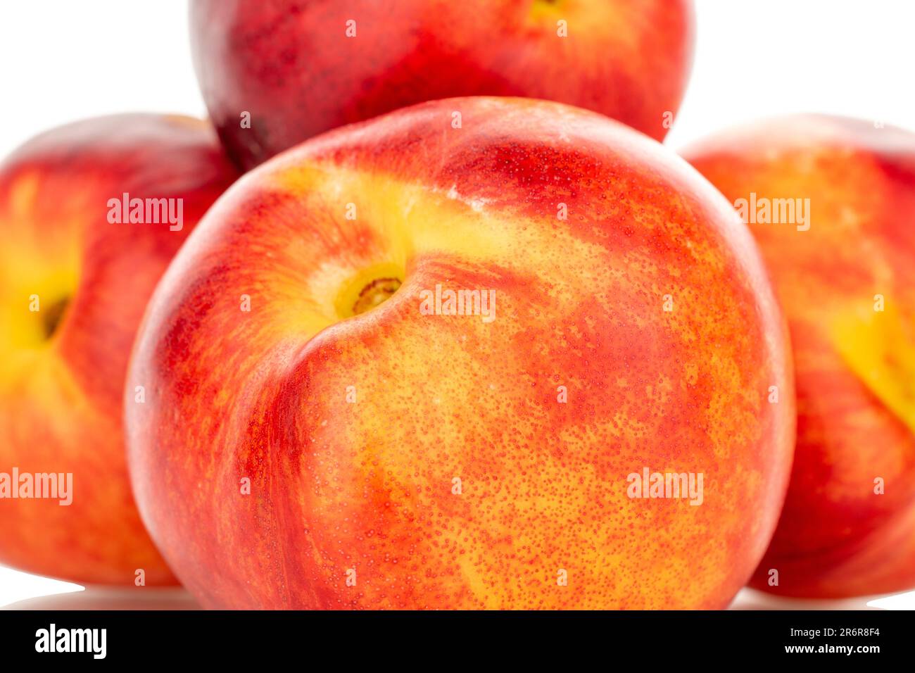 Several sweet nectarines, macro, isolated on white background. Stock Photo
