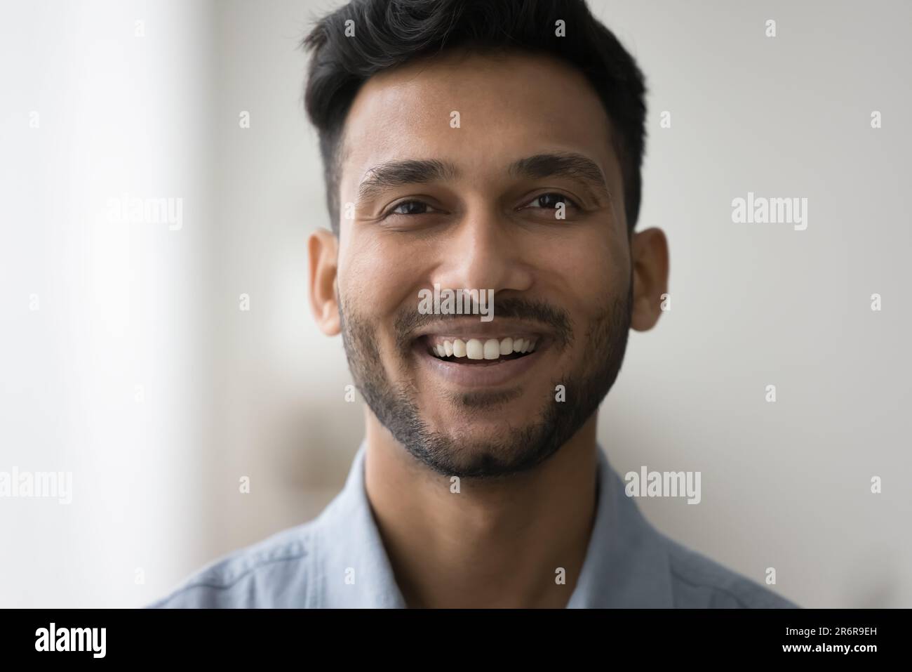 Cheerful handsome young Indian man front close up facial portrait Stock  Photo - Alamy