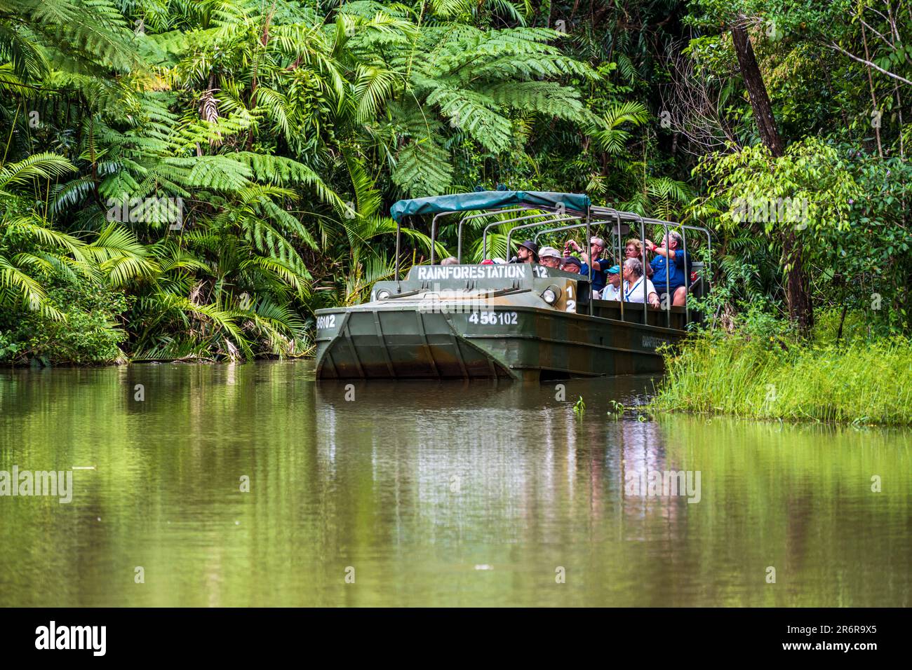 Barron Gorge National Park, Australia -- Feb 20, 2023. Photo of a tour group riding through the rainforest in an Army Duck amphibious vehicle. Stock Photo