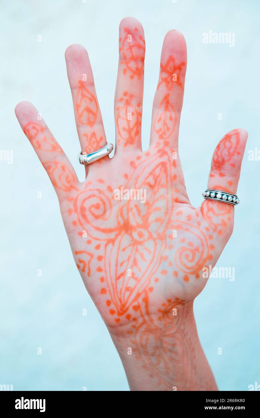 Woman´s hand decorated with henna and silver rings. Stock Photo