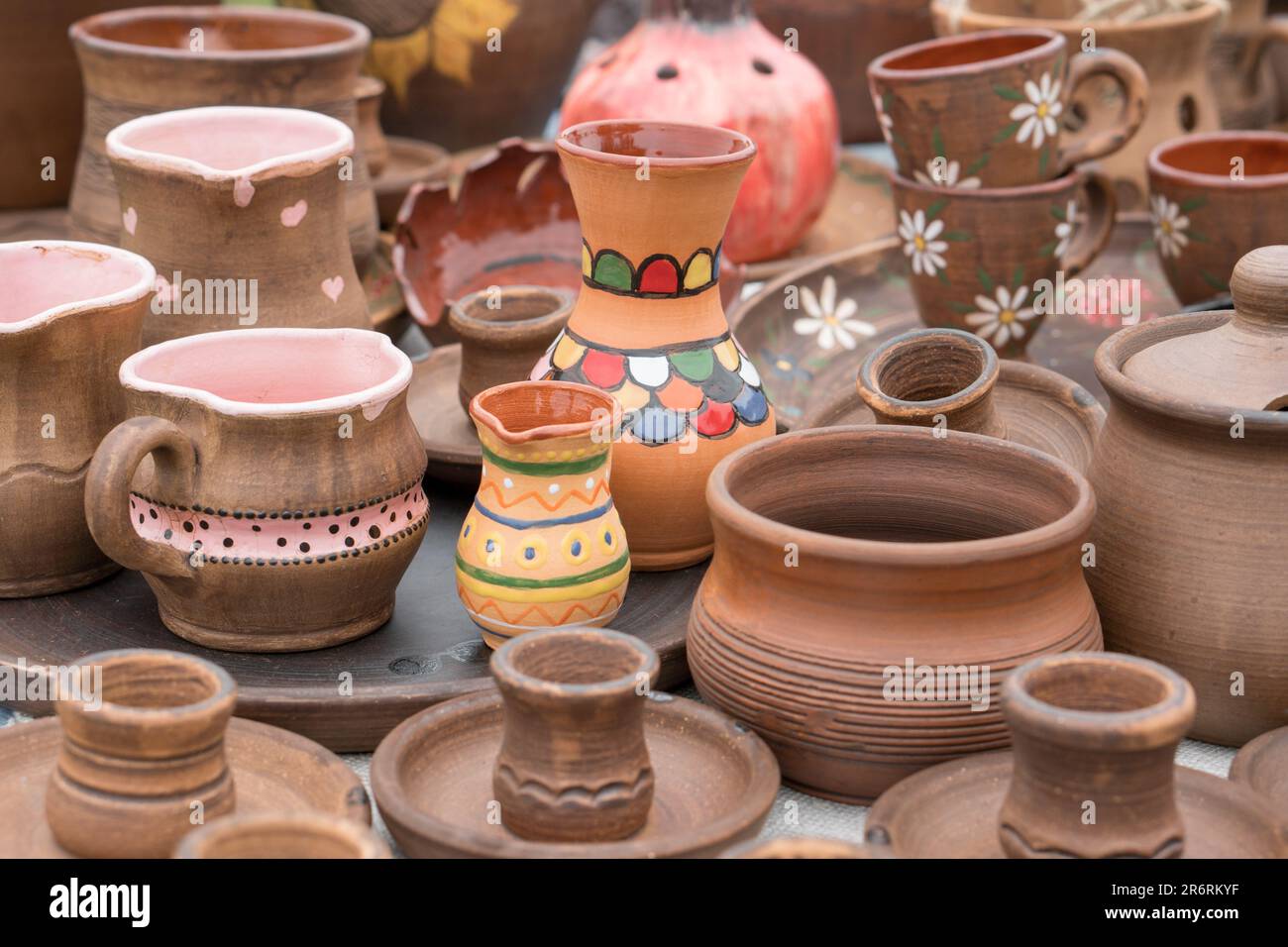Different examples of tradtional ukrainian clay pottery pots, jars