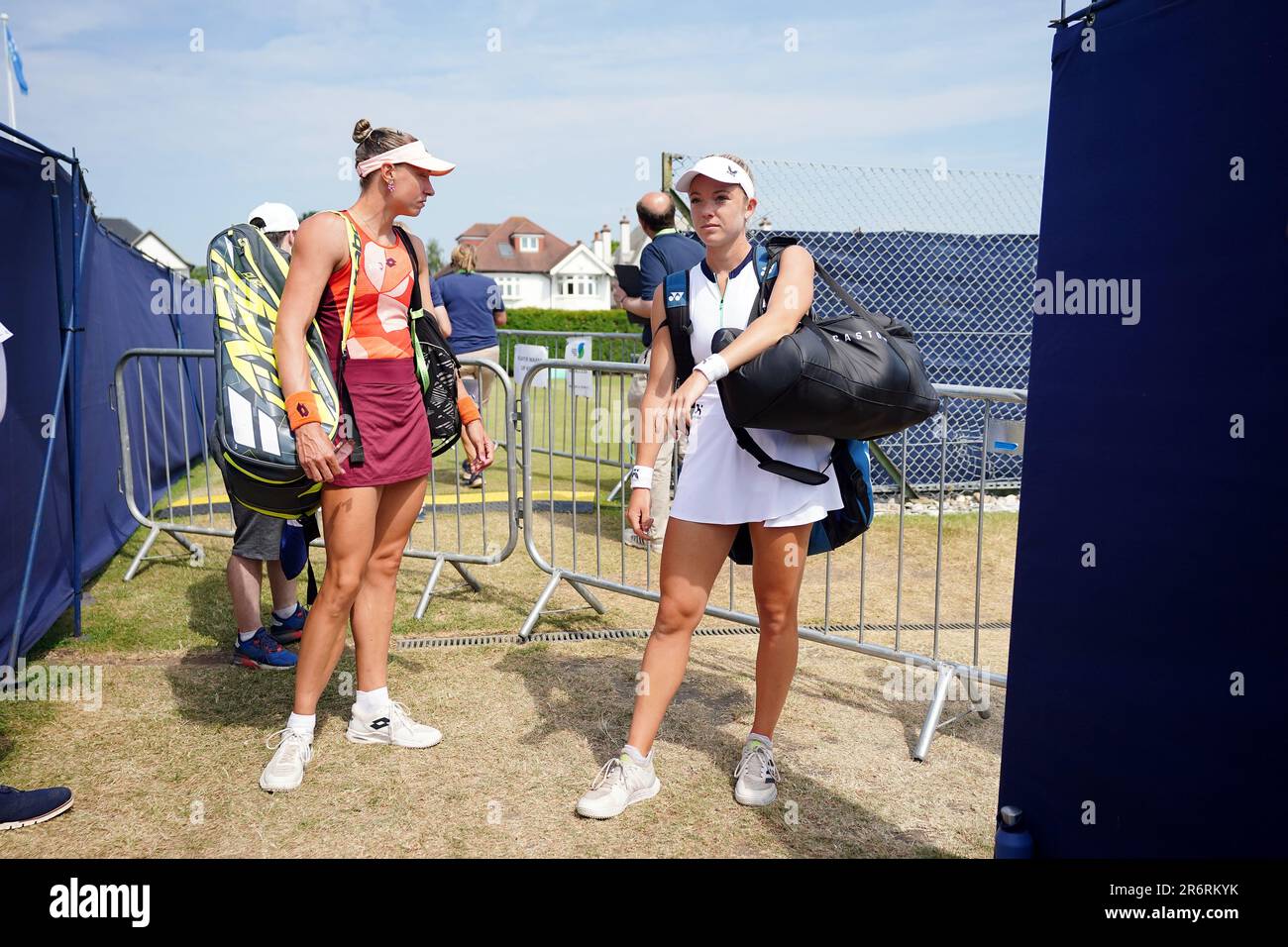 Yanina Wickmayer (left) and Katie Swan walk onto court for their final ...
