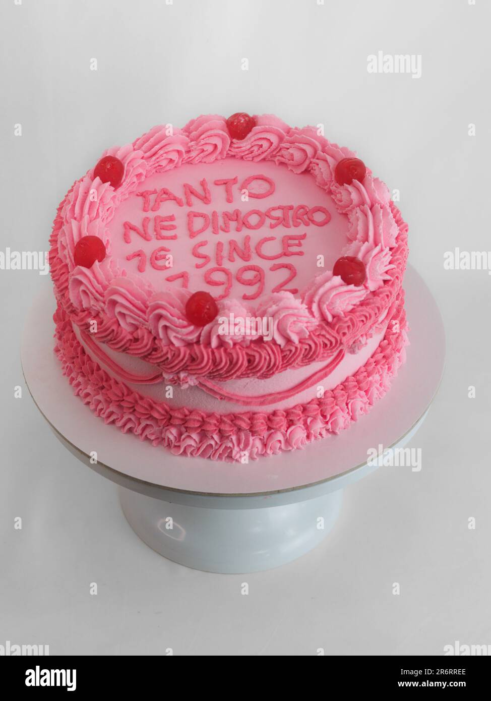 pink sweet frosted icing cup cake with italian english text sign ...