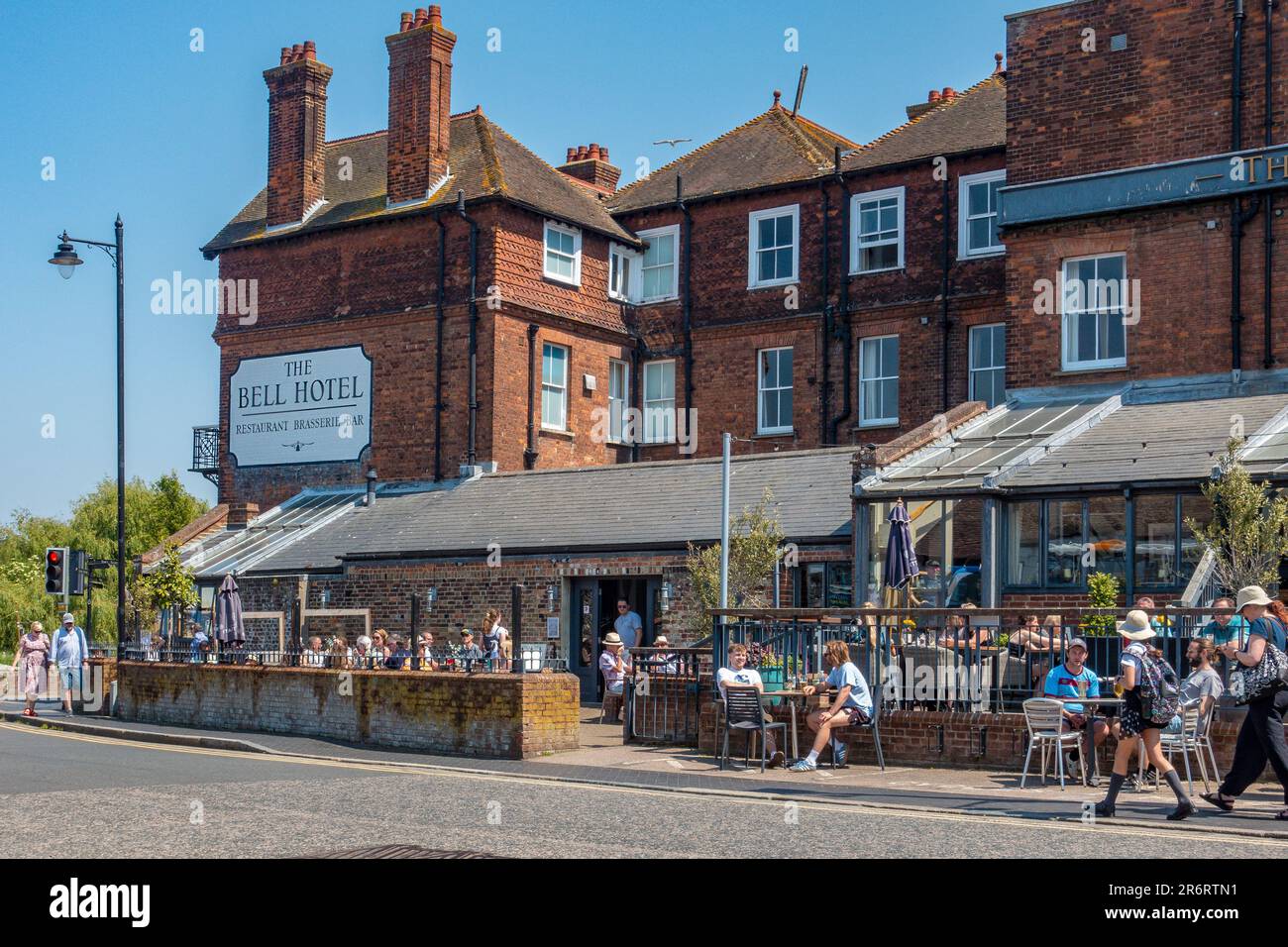 The,Bell Hotel,High Street,Sandwich,Kent,England,Drinkers enjoying the sunshine Stock Photo