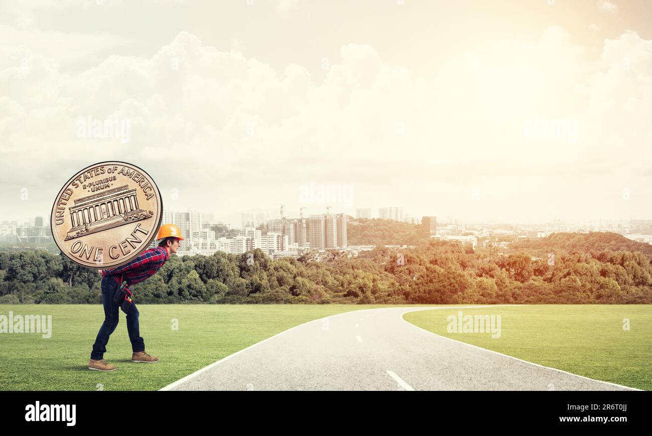 Builder man carry coin Stock Photo Alamy