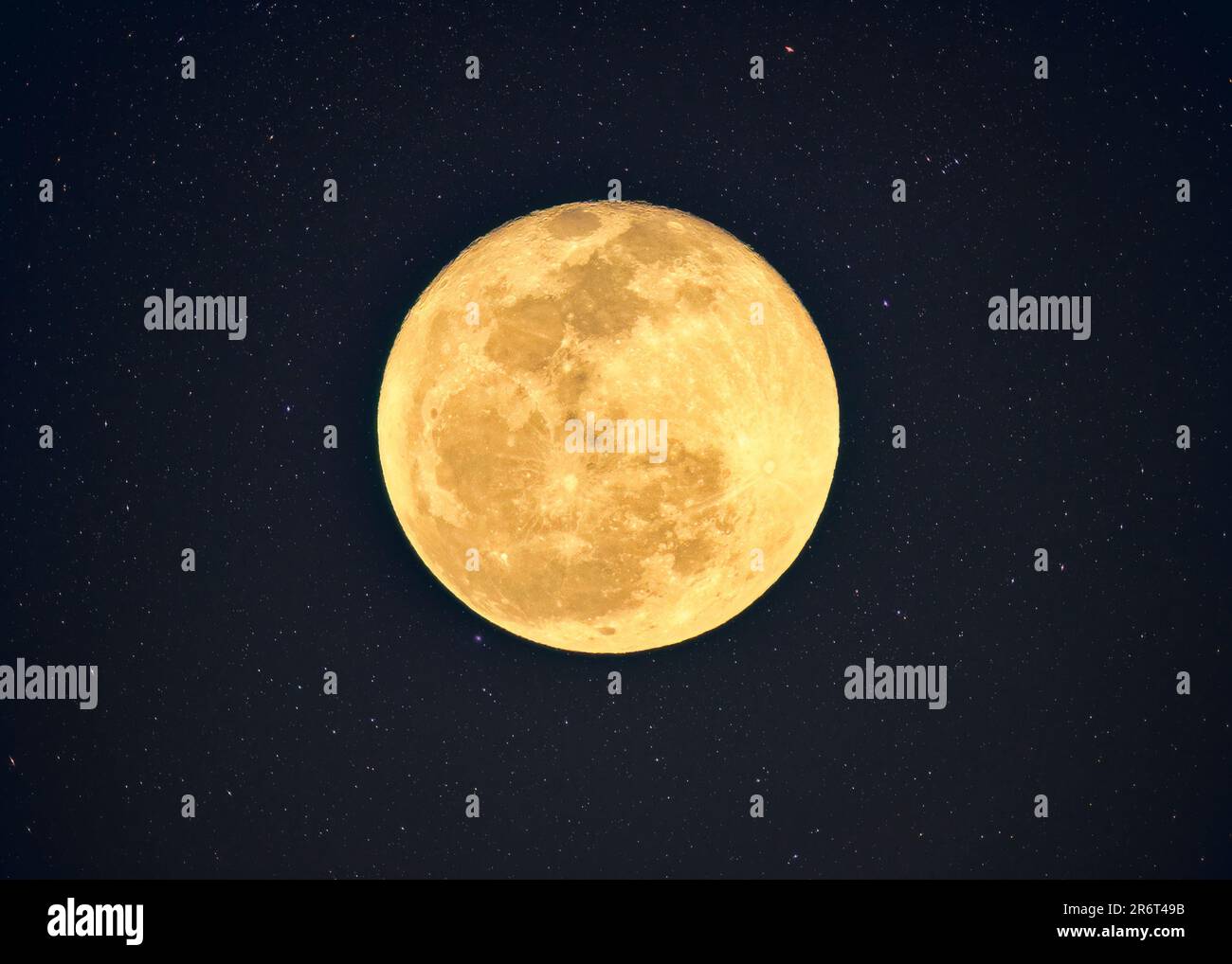 Phase of yellow full moon with crater textured glowing with starry in