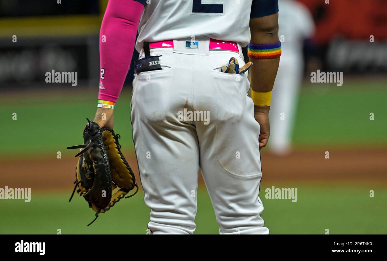Tampa Bay Rays' Yandy Diaz wears a rainbow arm band as the Rays celebrate  Pride day during a baseball game against the Texas Rangers Saturday, June  10, 2023, in St. Petersburg, Fla. (