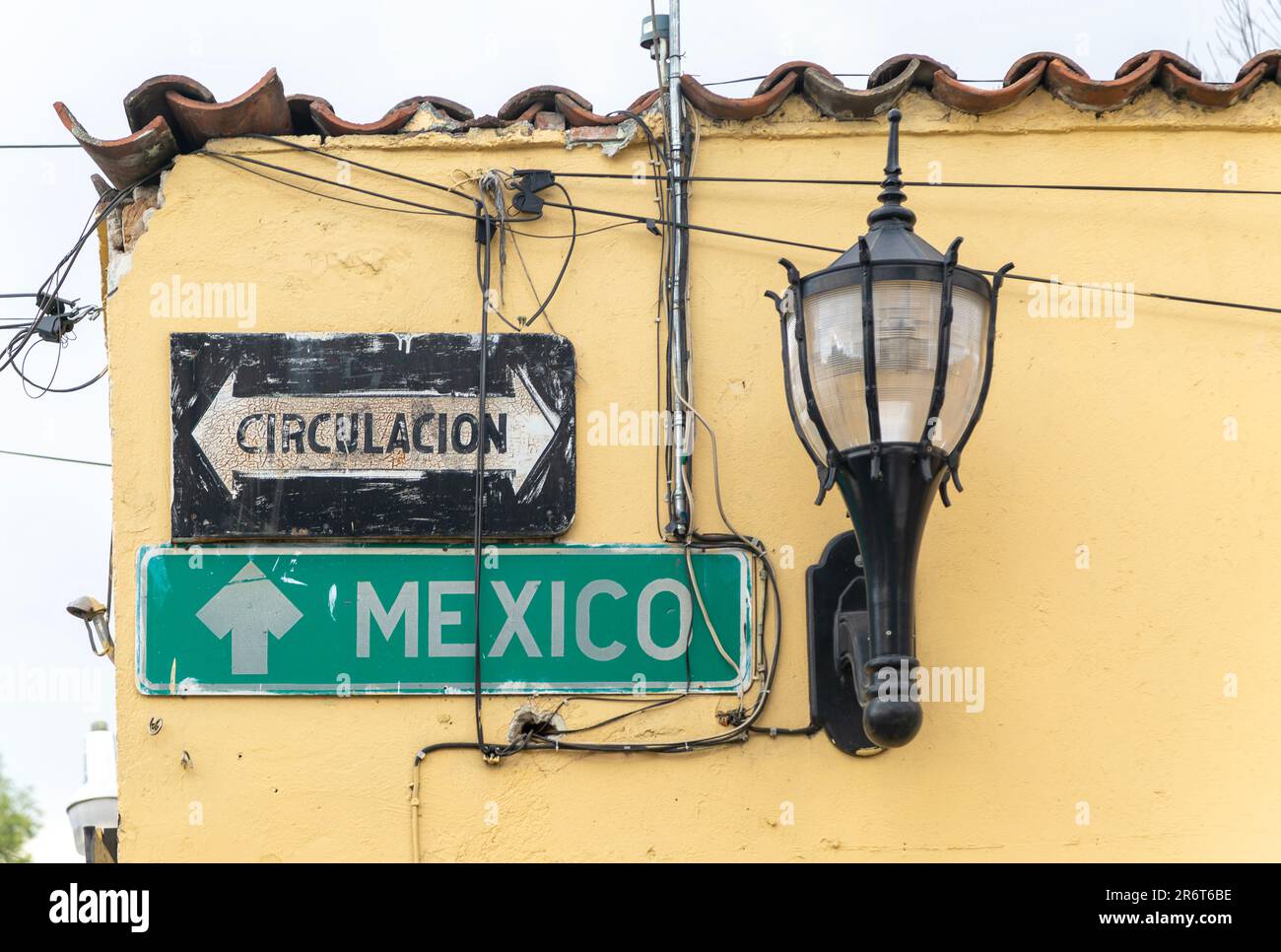 Road signs for Mexico City and Circulacion on side of building, Tepoztlán, State of Morelos, Mexico Stock Photo