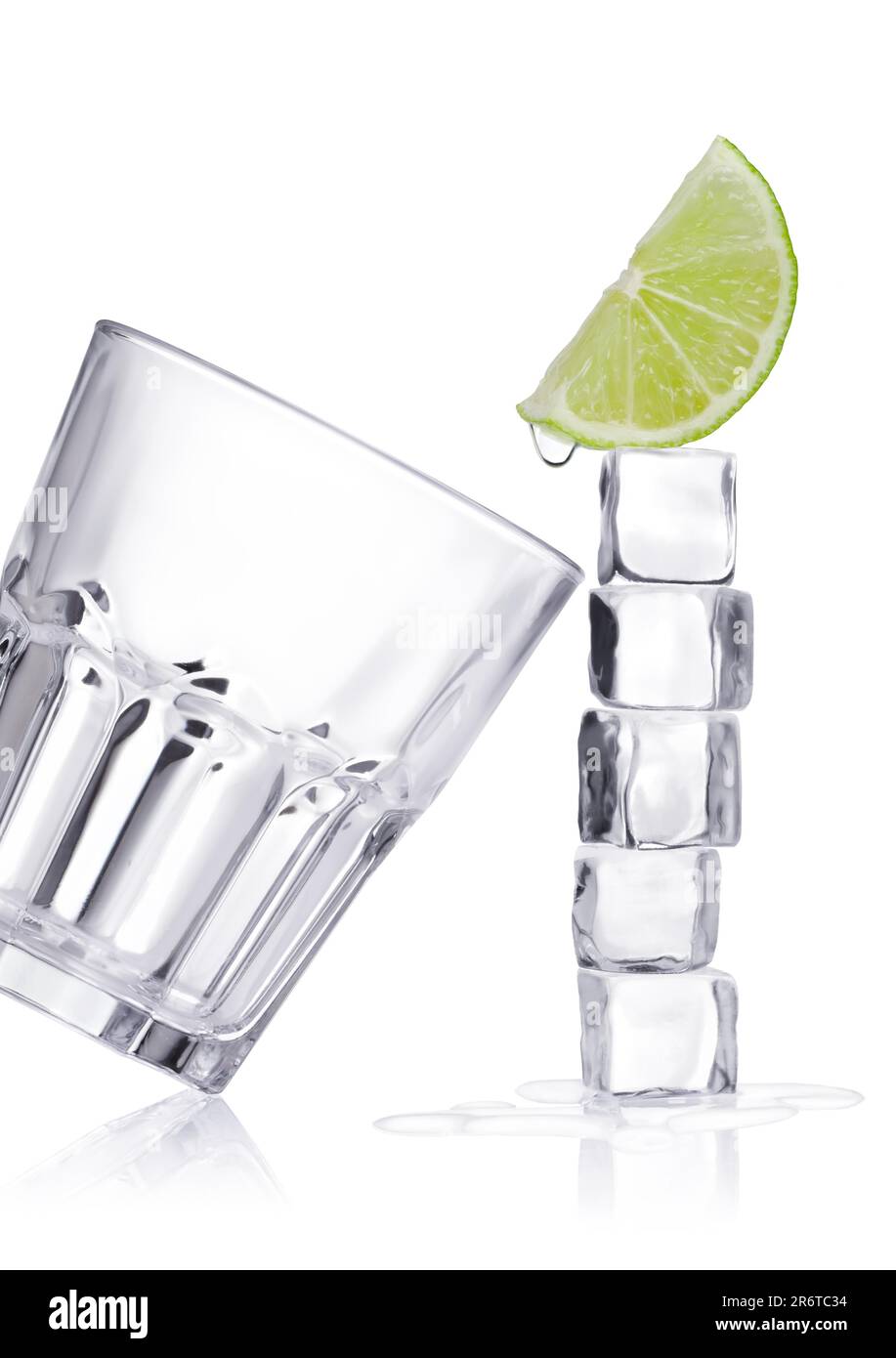 Ice cubes and glass on a white background and with soft shadow Stock Photo