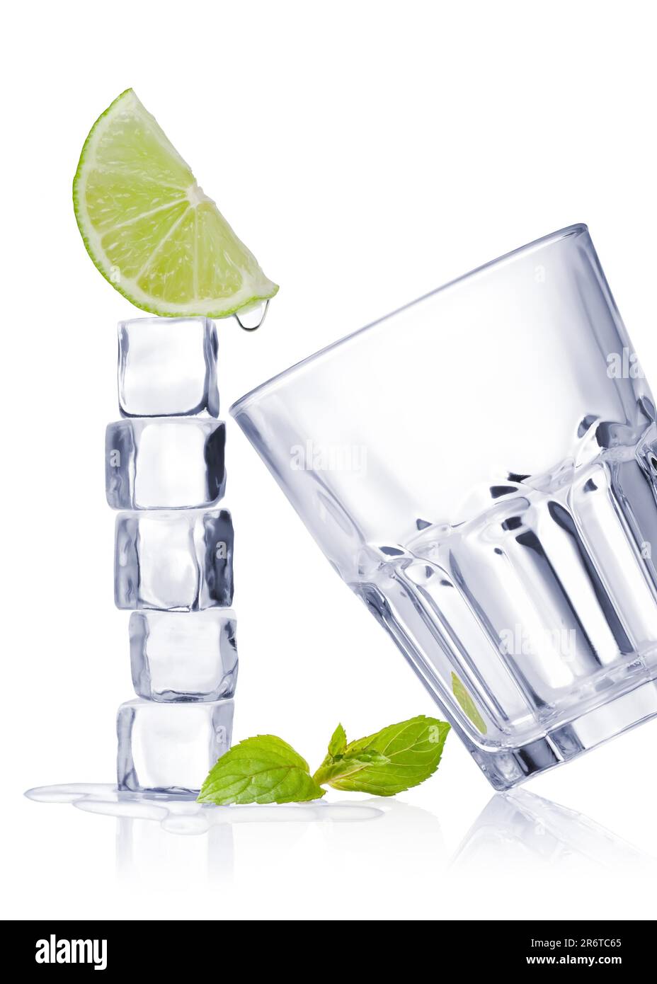 Ice cubes and glass on a white background and with soft shadow Stock Photo