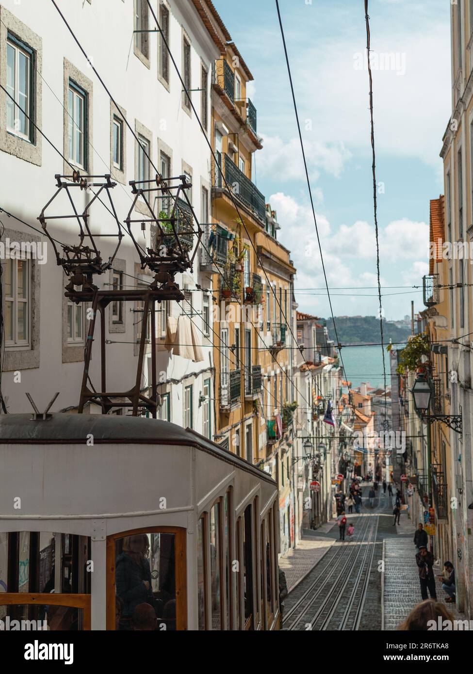 Bica funicular, frozen in a single frame, showcases Lisbon's charm. The historic tram ascends the steep streets, a symbol of the city's character and Stock Photo