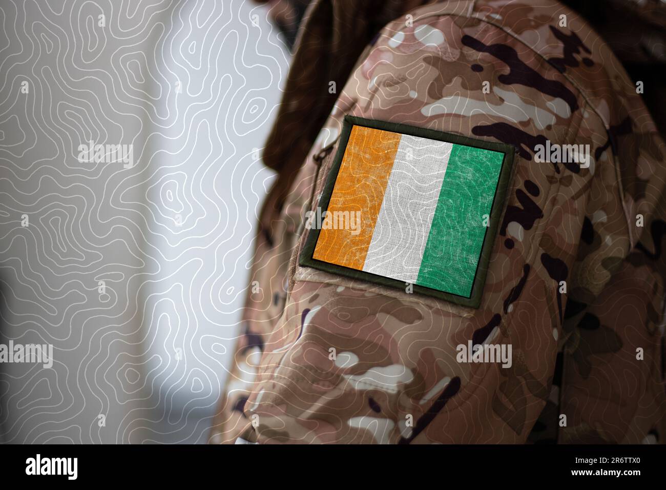 Ivory Coast Soldier, Soldier with flag Ivory Coast, Ivory Coast flag on a military uniform, Ivory Coast army, Camouflage clothing Stock Photo