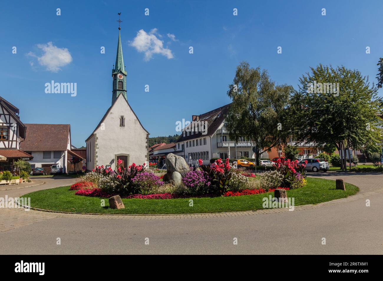 UNTERUHLDINGEN, GERMANY - SEPTMBER 3, 2019: Roundabout and St Quirinius chapel in Unteruhldingen town, Baden-Wurttemberg state, Germany Stock Photo