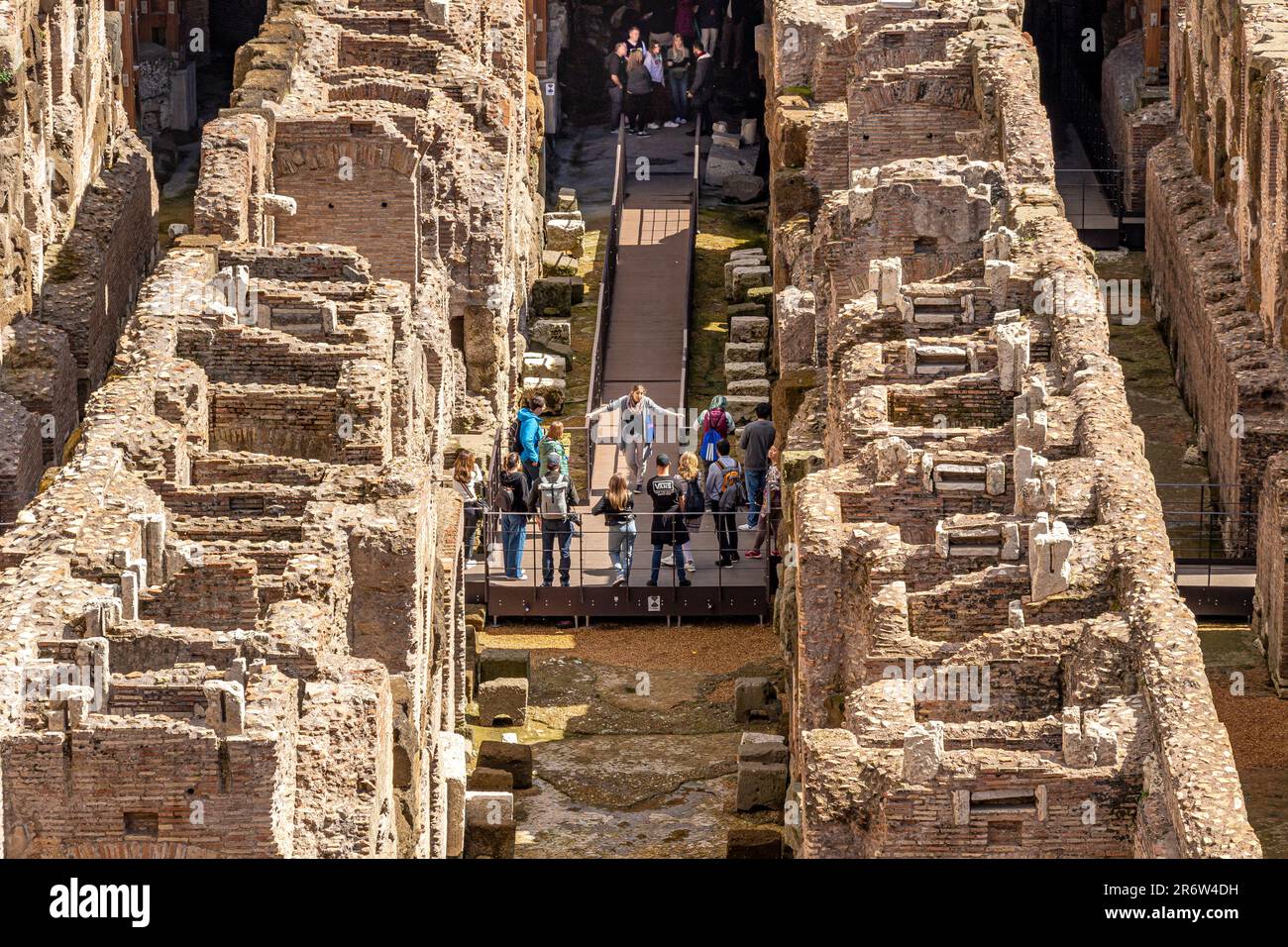 People visiting the underground dungeons, hypogeum area of the   lower level Colosseum in Rome ,Rome,Italy Stock Photo