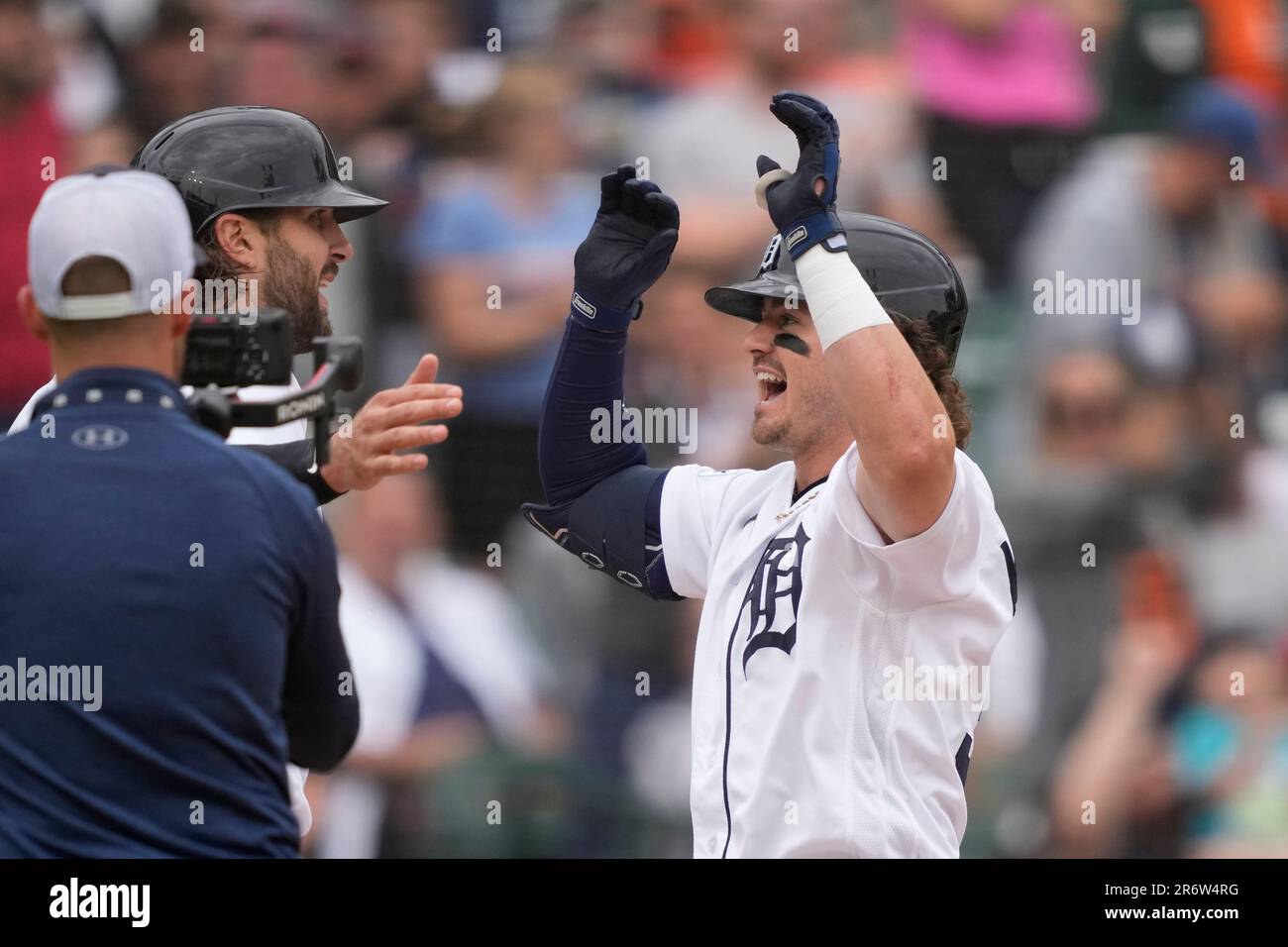 Detroit Tigers' Zach McKinstry, right, is greeted at home plate by Jake  Marisnick after they both scored on McKinstry's two-run home run during the  fourth inning of a baseball game against the
