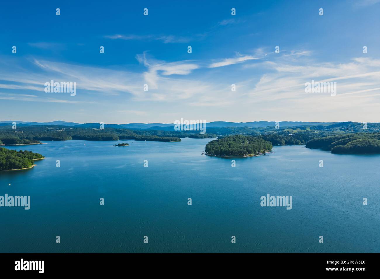 Panoramic view from the drone during sunset, on the Solina Lake over the Solina water dam, in the Polish Bieszczady Mountains, Poland Stock Photo