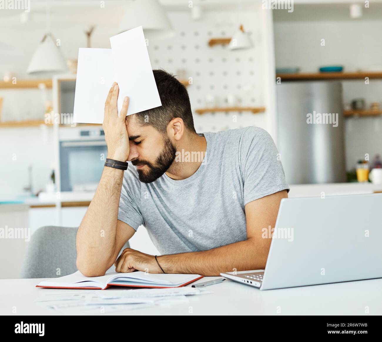 laptop man computer home tired young headache business problem study worried stress reading Stock Photo