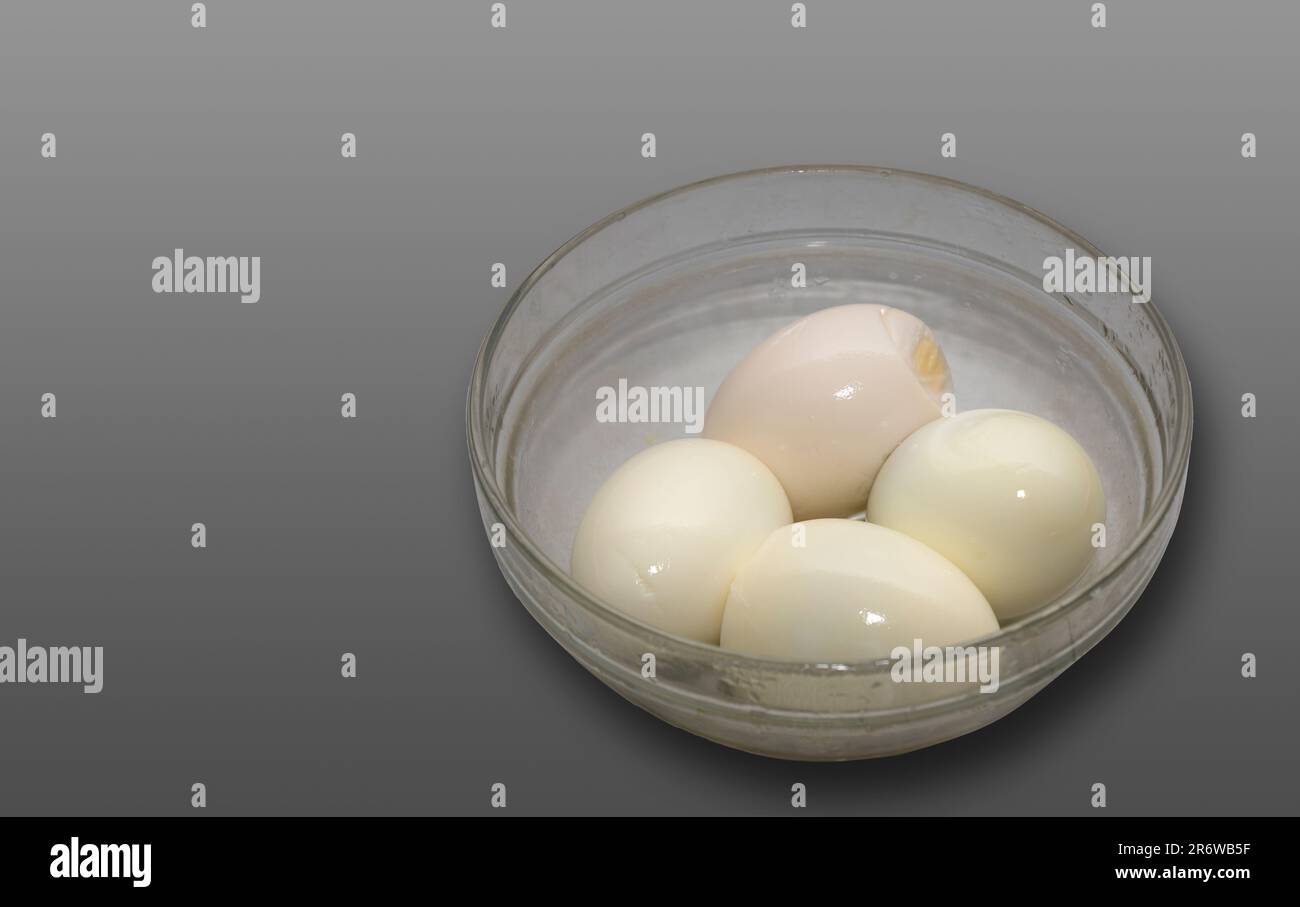 Closeup Image Of Boiled Eggs In Glass Bowl in Isolated Background Stock Photo