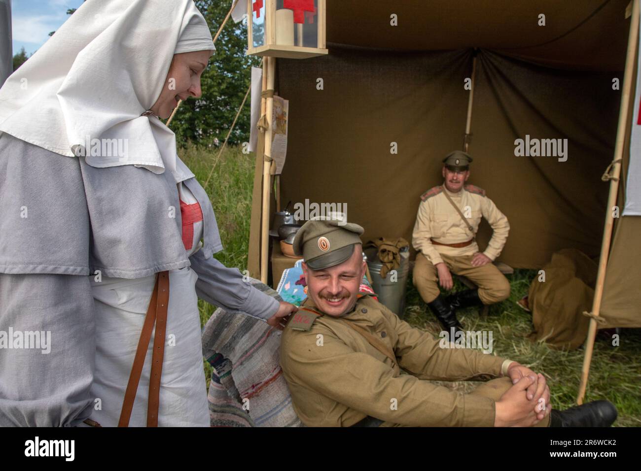 Moscow, Russia. 11th of June, 2023. A nurse of the Russian Red Cross Society of the First World War at a tent of a field hospital during the festival of historical reenactments titled 'Times and Epochs, in Moscow's park, Russia Stock Photo