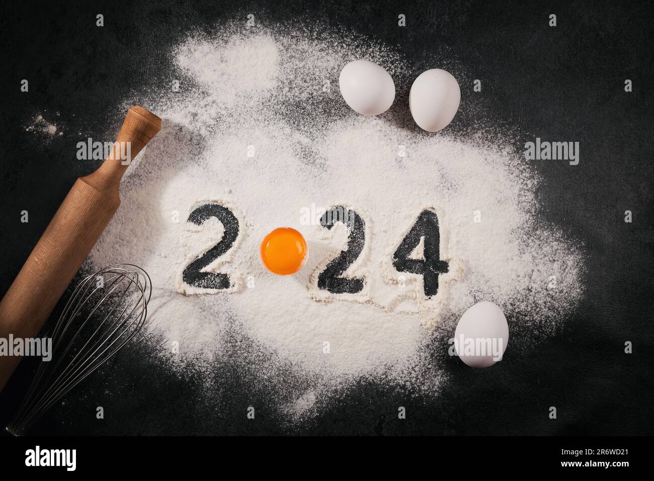 Creative Happy New Year 2024 greeting card for home baker Stock Photo