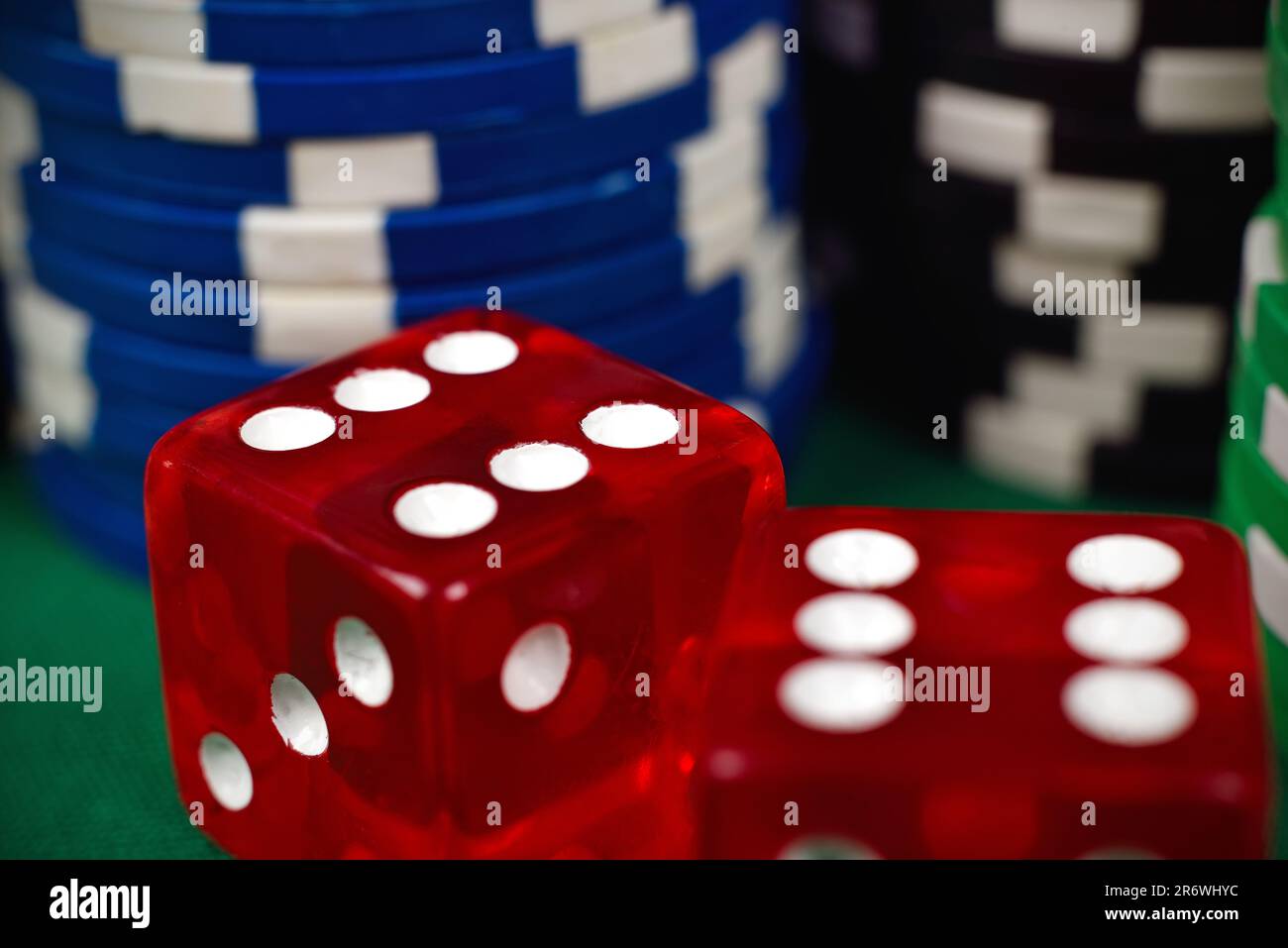 two red dice on green poker table Stock Photo