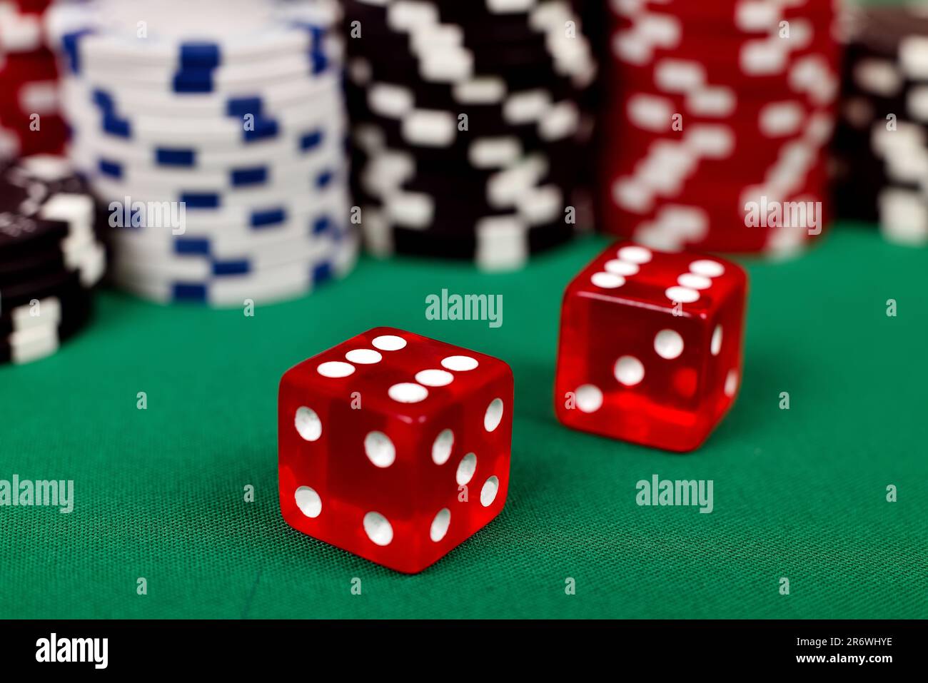 two red dice on green table, close up Stock Photo