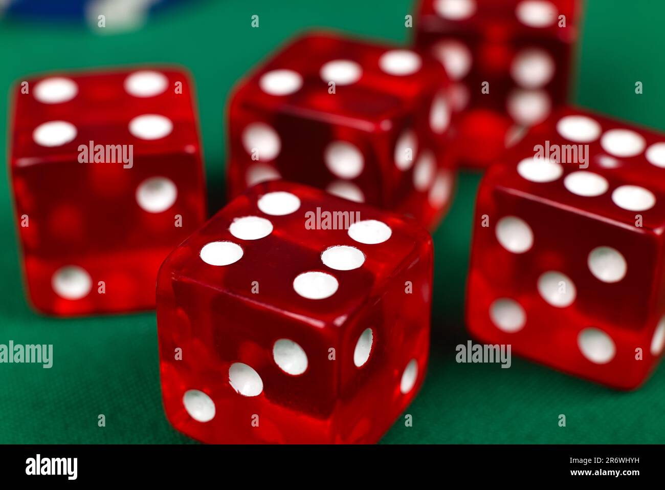 red dice on green table, extra close up Stock Photo