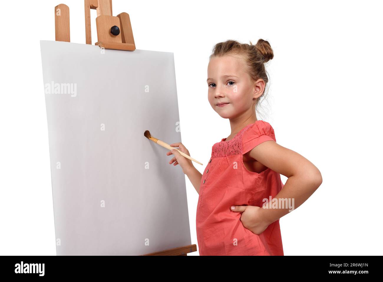 little girl is painting on easel Stock Photo - Alamy