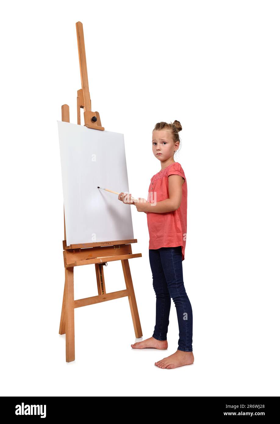 little girl painting on a blank easel Stock Photo - Alamy