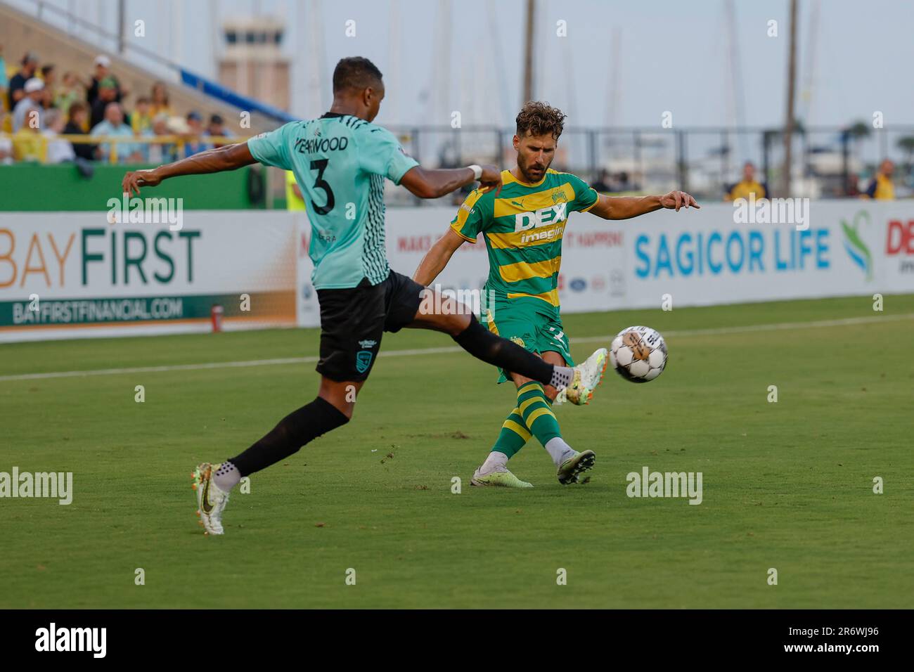 St. Petersburg, FL: Tampa Bay Rowdies forward Sebastian Dalgaard (23) kicks the ball across the field while New Mexico United defender Austin Yearwood Stock Photo
