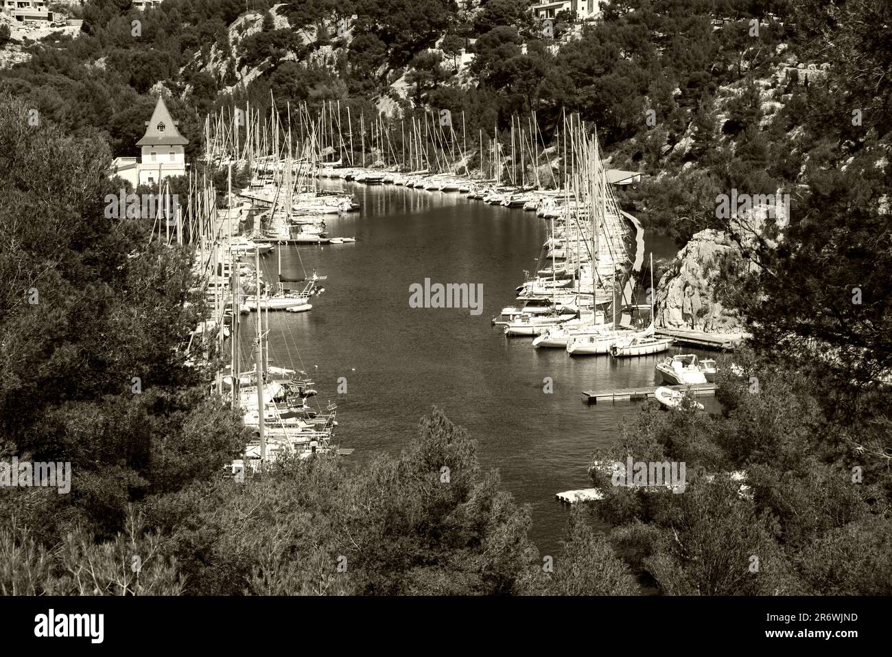 View of sailing boats mooring in marina of Calanque de Port-Miou. Calanques National Park, Cassis, France. Travel in nature. Sepia historic photo Stock Photo