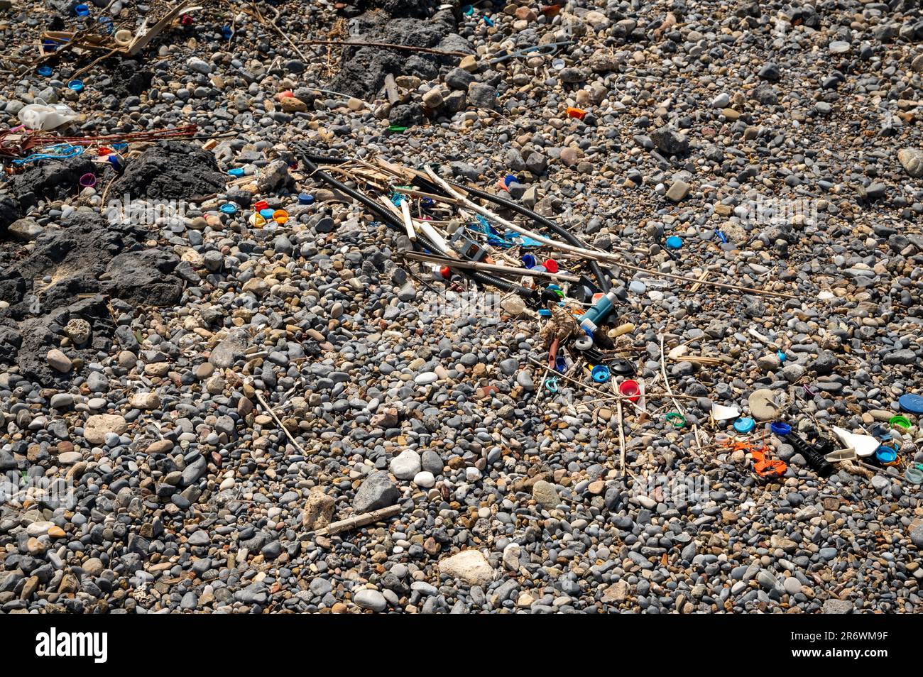 Washed up plastic waste (ocean plastic) on a beach polluting the oceans Stock Photo