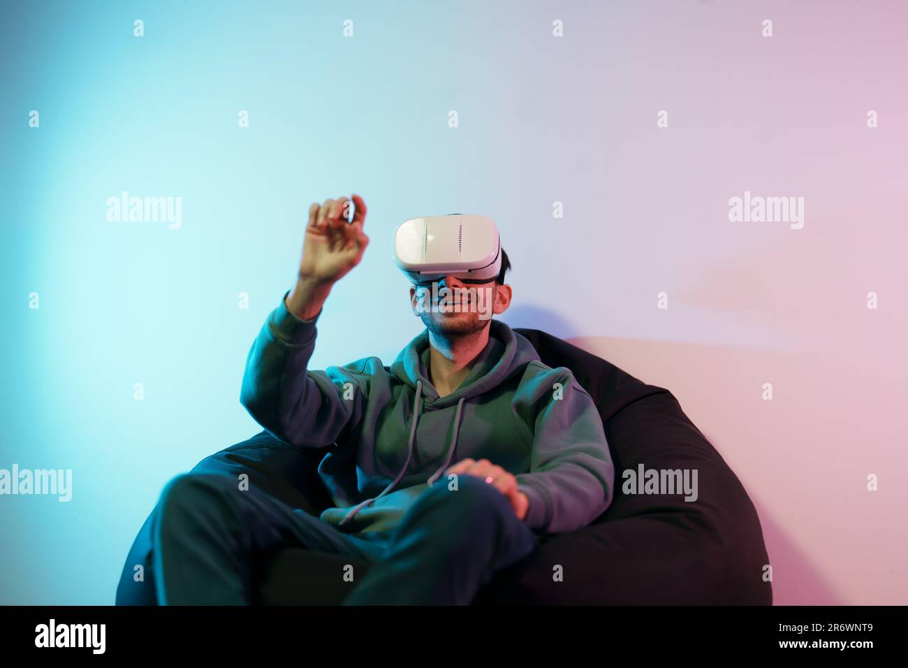 Man interacting with virtual object while using VR goggles Stock Photo ...