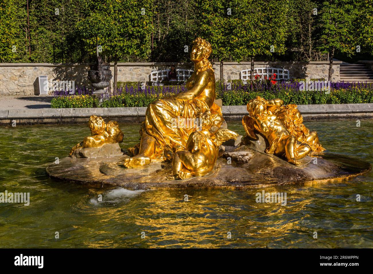 LINDERHOF, GERMANY - SEPTEMBER 4, 2019: Golden statue of goddess Flora and Puttos at the grounds of Linderhof palace, Bavaria state, Germany. Stock Photo