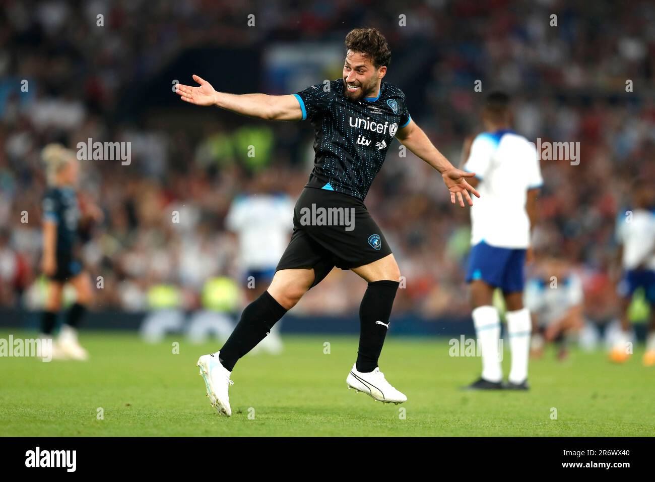 Soccer Aid World XI's Kem Cetinay celebrates scoring their side's