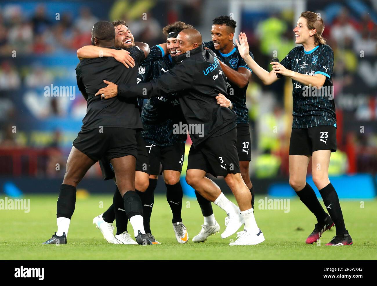 Soccer Aid World XI's Kem Cetinay (second left) celebrates scoring