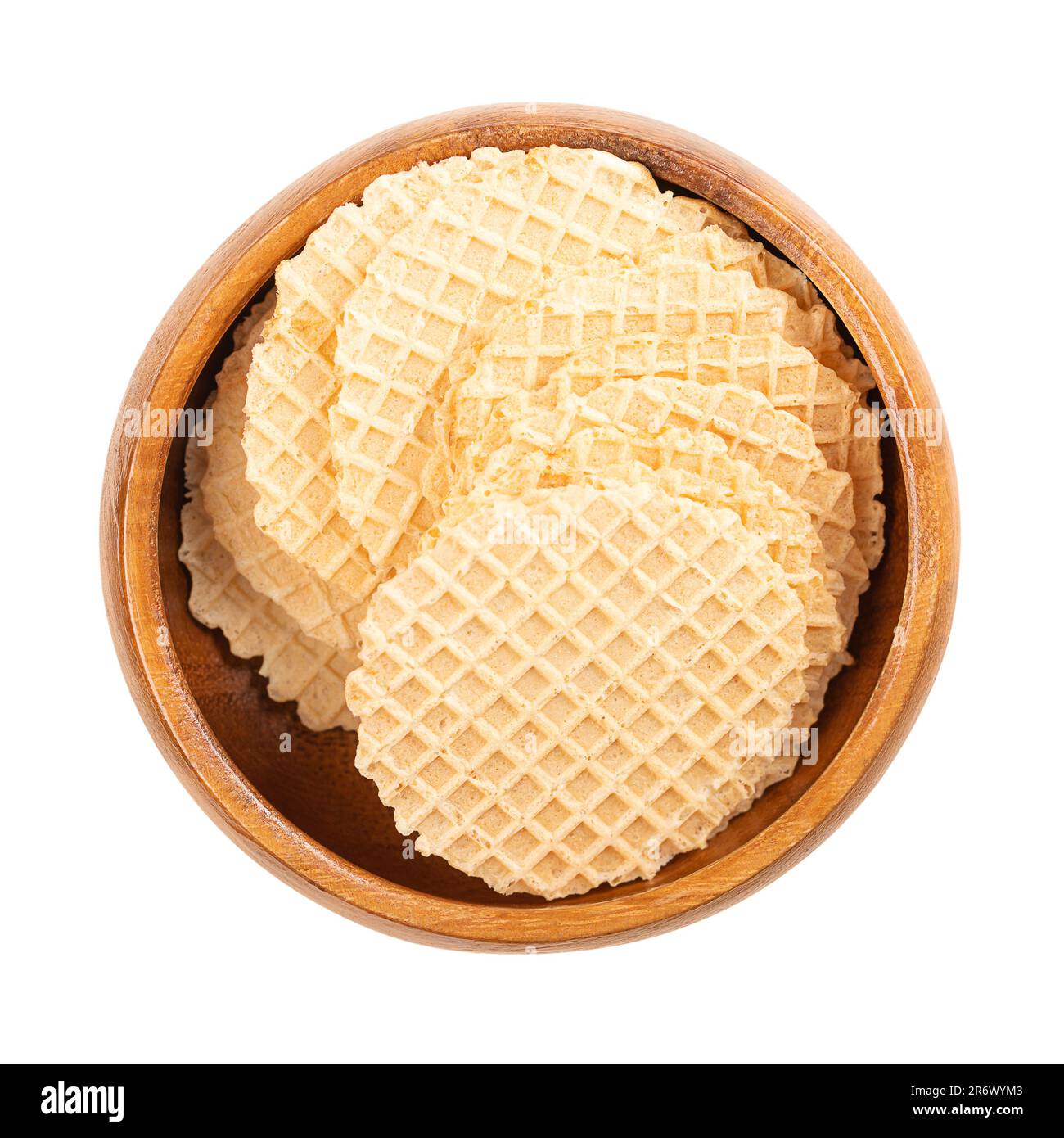 Cheese cracker in a wooden bowl. Snack in the shape of circular and wafer-thin slices, made of dough of wheat flour and cheese, baked crispy. Stock Photo